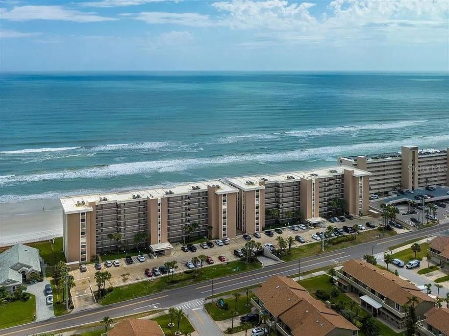 Welcome to your dream beachfront condo! This stunning 2 bed 2 bath oasis boasts breathtaking ocean views from every room. Imagine waking up to the sound of waves crashing on the shore and stepping out onto your private balcony to watch the sunrise over the horizon. The open-concept living space is perfect for entertaining guests and creating unforgettable memories. The spacious updated kitchen has ample counter space and seamlessly flows into the inviting living room and dining area. With an open layout, this home is perfect for entertaining guests while still maintaining a comfortable and inviting atmosphere. The main bedroom features an en-suite bathroom and two comfortable queen beds. While the second bedroom offers a plush king-sized bed and a separate bathroom. This turnkey unit comes fully furnished making it the perfect place to call home or rent out for short term stays. The unit also features in-unit laundry, making it easy to keep your beach towels and linens fresh and clean. You'll love the convenience of having a storage unit on the same floor, perfect for storing your beach gear and other belongings. And with your very own garage parking space, you'll never have to worry about finding a spot when you return home. But that's not all - this condo also boasts two pools, perfect for soaking up the sun and enjoying the warm ocean breeze. This unit has new impact resistant windows and sliders(2021), a new roof(2018), and a new AC unit(2021), you can rest easy knowing that your home is in top condition. Don't miss out on this incredible opportunity to own a piece of paradise. This beachfront condo has everything you need to live your best life by the ocean. ;Water: City