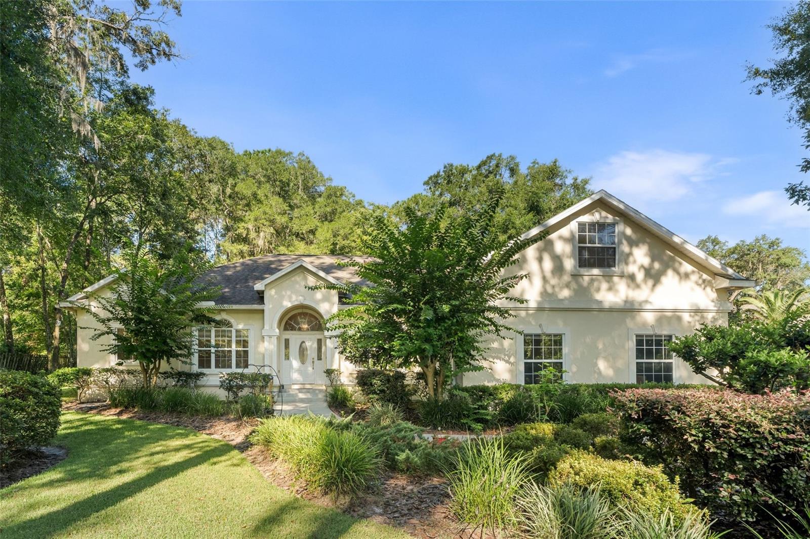 One or more photo(s) has been virtually staged. Tucked away in the desirable Cambridge Forest neighborhood of Gainesville, this spacious home is full of charm and plenty of room to spread out. Recent improvements include a new roof and gutters (2023), fresh interior paint, new carpet, and updated tile in the kitchen and laundry. The kitchen features Corian countertops, a step-in pantry, built-in desk area, and a brand-new stove, while the adjoining laundry offers a sink and washer/dryer that stay with the home. You’ll love the elegant details throughout, including crown molding, a tray ceiling in the primary suite, and beautiful hardwood floors in the sitting room. The flexible floor plan includes an office with built-ins that also functions as a bedroom, plus an upstairs bonus room perfect for hobbies or a play space. One bedroom even serves as a private suite with its own bathroom and large closet. Gather in the inviting living room with vaulted ceilings and a wood-burning fireplace, or enjoy Florida living at its best outdoors — the pool was resurfaced in 2025, the pool screen has been replaced, and the deck freshly painted. With multiple linen closets, plenty of storage, and fruit trees in the backyard, this home offers comfort and convenience in a prime Gainesville location.