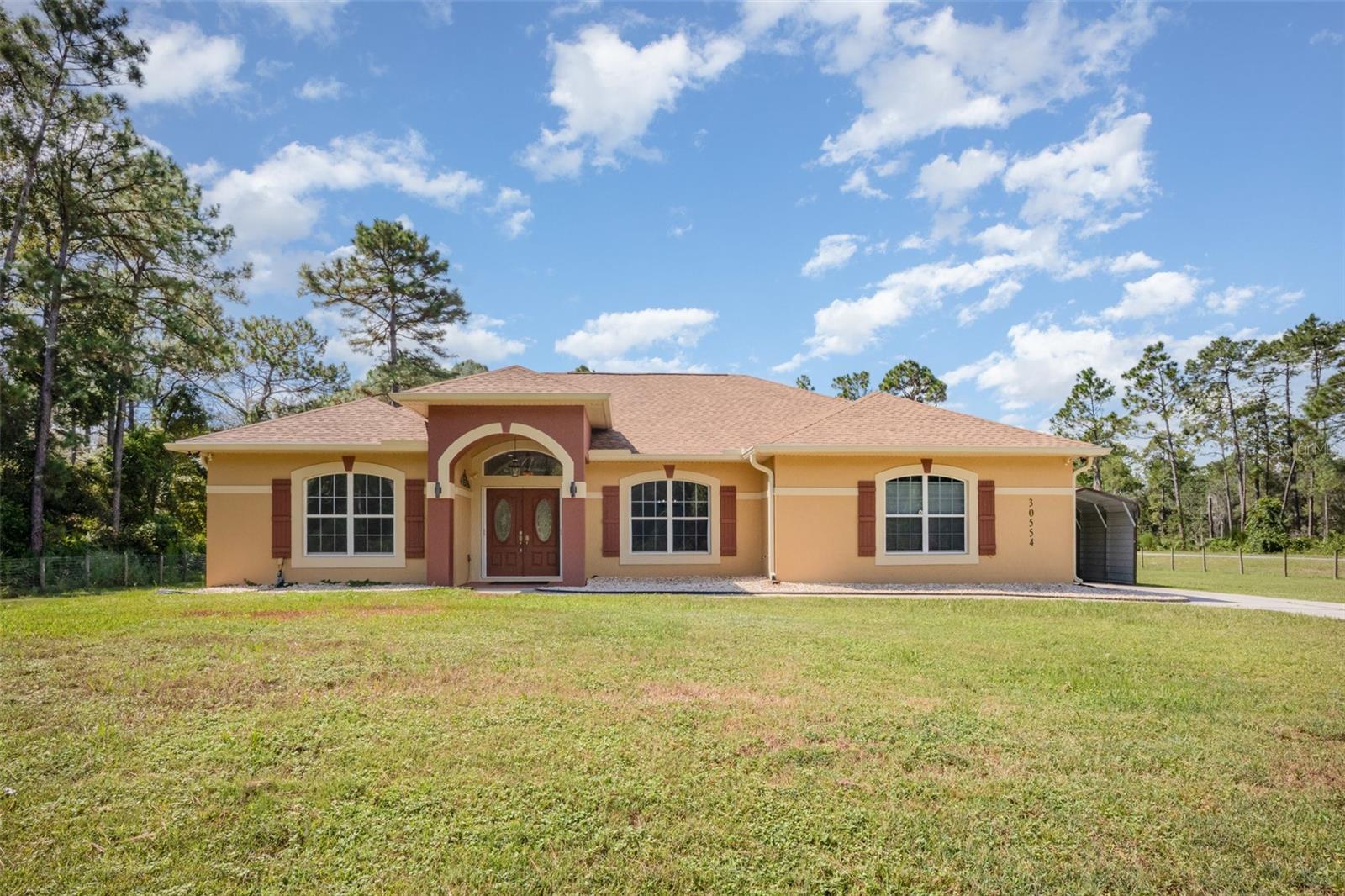 The home you’ve been waiting for is here! Set on a spacious one-acre corner lot in a quiet community with boat slip and lake access, this residence offers the perfect blend of relaxation and recreation. Enjoy Florida living at its finest with a sparkling inground pool, French doors leading to a covered lanai, and a cozy gas fireplace for year-round comfort.
The primary suite is a true retreat, featuring a luxurious bath with ceramic tile backsplash, dual sinks, a corner soaking tub, a separate shower, and a generous walk-in closet.
With its desirable location, inviting amenities, and private setting, this pool home is truly a must- see!