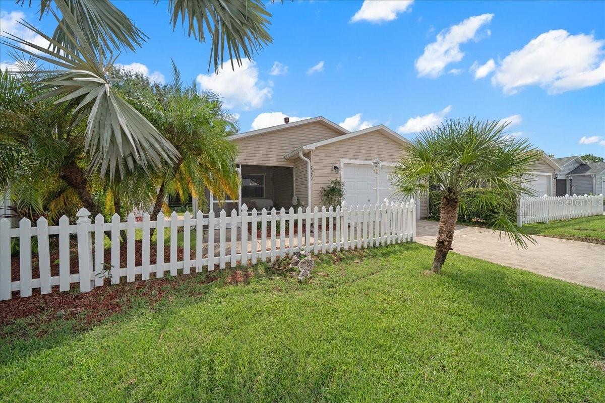 LOCATION is calling YOU, less than 5 minutes to LAKE SUMTER Square with a PAID BOND! This cute TURNKEY 2 bedrooms, 2 bath COLONY PATIO VILLA IN A FABULOUS LOCATION IN THE VILLAGE OF LIBERTY PARK. This adorable VILLA offers a screened porch. The front door opens to the main living area with vaulted ceilings. The living area offers a slider that brings in natural light and goes out to the side patio. The kitchen boasts a Nook area with Natural gas, a pantry, and an eat at bar. A hallway off the main living area leads to a guest bedroom & bathroom. The owner's suite bedroom is nicely sized with a walk-in closet, en suite offers 2 sinks with walk in shower. NO NEIGHBORS behind you. It's conveniently situated, making golf cart access a breeze. The Villages Lifestyle is at your fingertips, with endless shopping, dining, and entertainment options, plus NIGHTLY LIVE MUSIC to enjoy under the stars. Don't wait—schedule your showing today!