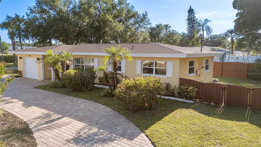 Perfectly positioned on a generous corner lot in one of the most sought-after coastal communities of Belleair, this charming home welcomes you with warmth, style, and a true sense of comfort.  Ideally located between the Belleair Country Club and the Pelican Golf Club, and just a short distance to the Gulf beaches, this home offers the best of Florida living.  Enjoy the golf cart community with convenient access to the Belleair Recreation Center, offering tennis courts and a variety of activities for all ages.  The home has been updated with a newly remodeled kitchen, updated bathrooms, plantation shutters and beautiful hardwood floors, along with a newer roof and A/C.  From the moment you arrive, the pride of ownership is evident, highlighted by a brick-paved circular driveway, manicured lawn and well-maintained exterior.  The backyard is designed for entertaining and relaxation, featuring an oversized patio.  This is an exceptional opportunity to own a beautiful home in a premier Belleair location.  Don't miss the chance to make it yours.