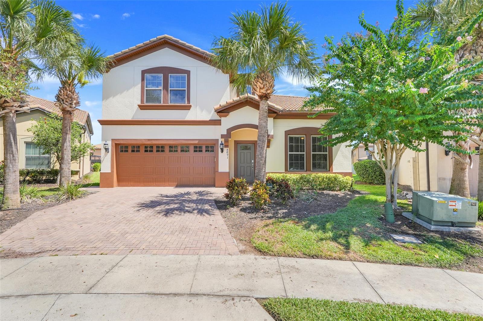 This LUXURY VILLA, featuring 8 bedrooms and 6 bathrooms, is located in the Windsor at Westside Resort in Kissimmee. It is not just another property; it is a beautifully designed home that impresses from day one and is built to perform for years to come. Situated on a PREMIUM OVERSIZED LOT on a peaceful cul-de-sac within this GATED community, the Villa offers rare privacy and a quick 3-minute walk to the clubhouse, resort pool, and gym. Inside, DIAMOND-pattern tile floors and elegant CROWN MOLDING accent both main gathering spaces, adding a refined finish upstairs and down. Ceiling fans in every bedroom and an upstairs wet bar with beverage refrigerator support a true second living zone, reducing kitchen traffic and improving flow for large groups. The flexible layout accommodates multi-generational families, large groups, or private retreats. Thoughtful upgrades throughout and a complete TURNKEY setup with furnishings, decor, linens, cookware, and extra supplies for quick replacement when items wear or break. The home has been meticulously maintained, including a certified Sherwin-Williams exterior repaint, for worry-free living from day one. Outside, the HEATED SALTWATER POOL and SPA provides bright morning sun and comfortable afternoons, while the SCREENED lanai features pet-resistant mesh, dining and lounge areas, a ceiling fan for year-round enjoyment, and cast-iron furniture that is durable and low-maintenance. Major systems are app-connected—HVAC, pool & spa (iAquaLink), lighting (Lutron), security, water heaters (Essency EXR), and the Schlage front-door smart lock—with whole-home mesh Wi-Fi (Eero) and Spectrum internet included in the HOA. The Villa features two independent HVAC systems, one serving each floor, upgraded air purification (REME HALO), SMART thermostats, two high-capacity Essency EXR water heaters, and a Whirlpool stainless-steel kitchen suite with extra appliances, all built for comfort and reliability. Additional features include an EV-ready NEMA 14-50 outlet in the garage (this garage has not been converted, preserving parking and storage), two LG ThinQ washer/dryer towers for efficient turnovers, exterior cameras, smart locks, hard-wired security system, TAEXX in-wall pest control with an exterior service port (service without entering the home), automated Lutron LED lighting, emergency lighting, and two commercial-grade fire extinguishers. Whether envisioned as a primary residence, seasonal retreat, or short-term rental investment, this Villa combines space, privacy, technology, and enduring value in one of Central Florida’s most desirable resort communities—close to Disney World, Universal Studios, SeaWorld, golf courses, and shopping centers. Opportunities like this—Phase One oversized lot, premium upgrades, true turnkey readiness—are rare. DON’T MISS your chance to make it yours!