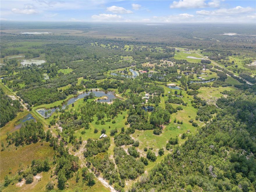 WOW.... this 160 Acres of Land WITH HOME, BARNS, SHEDS, etc. in a most sought-after DeLand area.  It includes ponds and lakes throughout.  You can turn this into your own oasis or create it into various acreage estates.  There are several ponds stocked with fish and lots of wildlife throughout.  It is possible that this property can also be zoned for development and is a great opportunity to purchase!  Come and walk this INCREDIBLE LAND!! (FLORIDA'S LARGEST AIRSOFT COURSE BUSINESS WITH EQUIPMENT IS OPTIONAL & COULD HELP PAY FOR THE PROPERTY!!) Another Plus... the Owner is Offering OWNER FINANCING! THIS SUBJECT PROPERTY (listing) has 2 parcel numbers. one listed on item sheet and ( 241728000400000400)