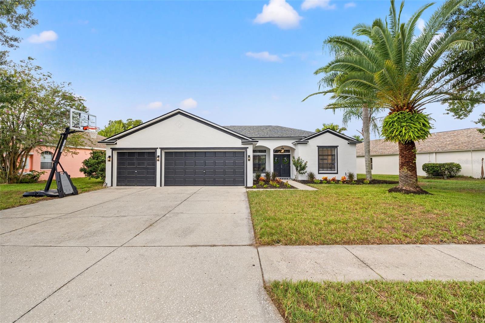 Welcome to Wyndham Lakes! This beautifully maintained Odessa pool home blends comfort, style, and breathtaking sunsets. Boasting 4 bedrooms, 3 baths, and a 3-car garage, the open-concept layout features two living areas, a separate dining space, and a spacious kitchen. Rear sliders provide effortless access to the pool and patio, perfect for entertaining or relaxing evenings outdoors.
Step outside to a saltwater pool with a covered patio overlooking a serene pond, conservation area with towering cypress trees, and views of Osceola Lake, ideal for morning coffee or evening sunsets.
The split floor plan ensures privacy, with a primary suite offering direct pool access, dual closets, and a spa-like ensuite with a garden tub, dual vanities, and a walk-in shower. Additional bedrooms are thoughtfully separated, and the third bath is conveniently accessible from inside the home and the pool deck.
Other highlights include NEW Roof (2024), updated light fixtures (2025), recessed lighting, ample storage, indoor laundry with washer/dryer, fresh interior and exterior paint (2025), new exterior lighting (2025), and HVAC (2019).
Located in top-rated school zones, Hammond, Martinez, and Steinbrenner, this home also offers no CDD, low HOA fees, and Flood Zone X with no history of flooding. Enjoy convenient access to shopping, dining, and easy commuting via the Veterans Expressway/Suncoast Parkway to Tampa.