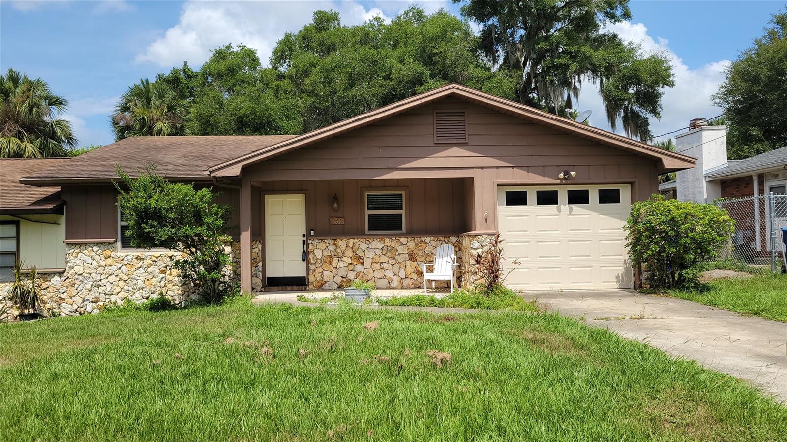 DELAND: This lovely move-in ready half duplex boasts a brand new roof and a thoughtfully updated interior. Enjoy a stylish kitchen with granite countertops, rich wood cabinetry, stainless steel appliances. Modernized bathrooms, a cozy wood burning fireplace, tile and laminate flooring. Additional highlights include a new water heater, attached garage and garage door opener, in-garage washer and dryer, attached garage with garage door opener. The spacious, privacy-fenced backyard features mature landscaping—ideal for entertaining or unwinding. Located near historic downtown DeLand, Stetson University, and just 2.5 miles from I-4.