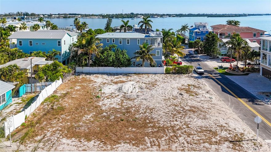 Vacant lot on Gulf Dr S located directly across the street from the Gulf of Mexico. Easy access to the beach, local restaurants, shops, and marina. Just a walk or golf-cart ride away from Bridge Street.  Build your custom home or investment build, subject to local zoning and permitting requirements. Great opportunity to create a coastal property on this large parcel.