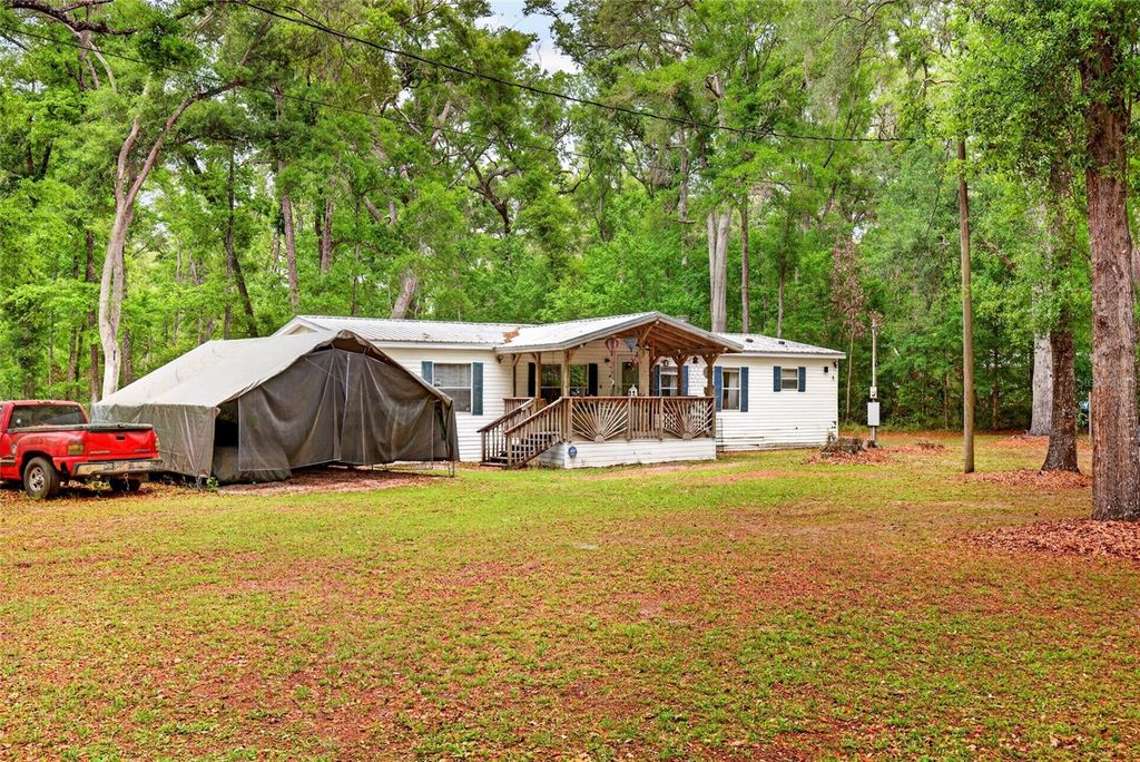 Photo of 1502 NE 644th Street, Old Town, FL 32680 (MLS # OM722511)