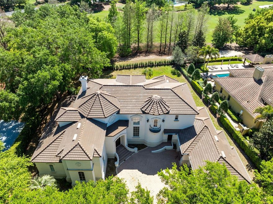 Set along the lush fairways of Isleworth’s exclusive golf course, this Mediterranean-inspired villa blends timeless elegance with an incredible opportunity to create something truly special. Freshly updated with a new roof, newer air conditioning units, most of the windows have been replaced. The home has new paint inside and out, and new wood flooring upstairs. 

Starting at the grand wooden doors and you’re immediately greeted by soaring ceilings in a sunlit two-story living room anchored by a striking stone fireplace. Every detail feels expansive and airy, with travertine floors and natural light flowing seamlessly throughout.

One of the standout spaces is the stunning two-story study—wrapped in rich wood paneling and connected by an elegant wrought iron staircase. Whether you imagine it as a private office, library, or a statement-making lounge, it’s a space that invites both function and style.

On the main floor, the primary suite is designed for indulgence, with a spa-inspired bathroom and a custom walk-in closet. Upstairs, a spacious loft leads to three en-suite bedrooms, giving family or guests privacy and comfort.

The kitchen is a blank canvas waiting to become a chef’s dream, complete with a butler’s pantry and bar area perfect for entertaining or curating your wine collection. There’s even an additional bedroom near the laundry area with the option to add another full bath—giving you even more flexibility to customize this home.

Located in the heart of Isleworth’s guard-gated, golf course community, this home offers not just luxury but lifestyle. Priced to reflect its potential, it’s ready for someone to elevate it into something exceptional and make it their own private retreat.