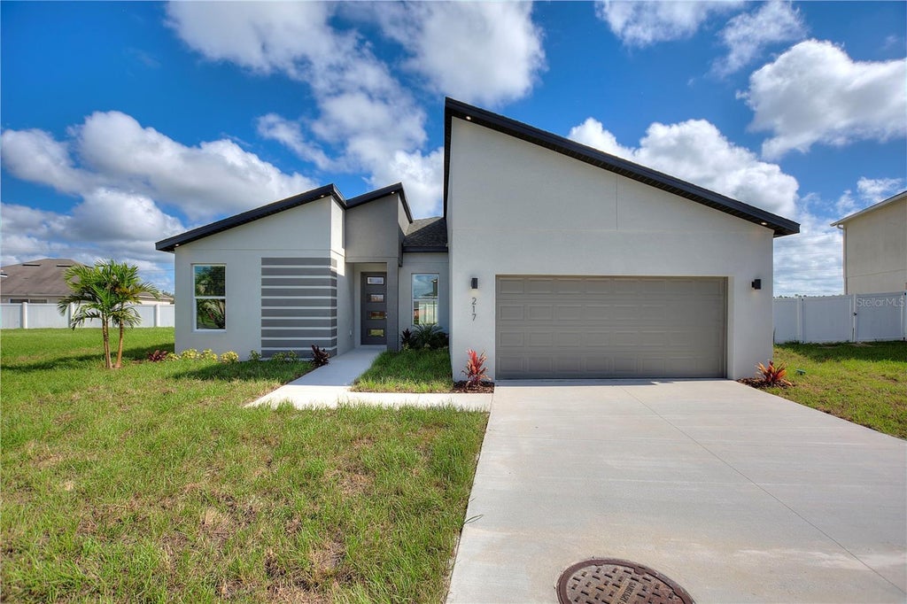 Photo of 217 Cimarron Drive, Poinciana, FL 34759 (MLS # O6441673)