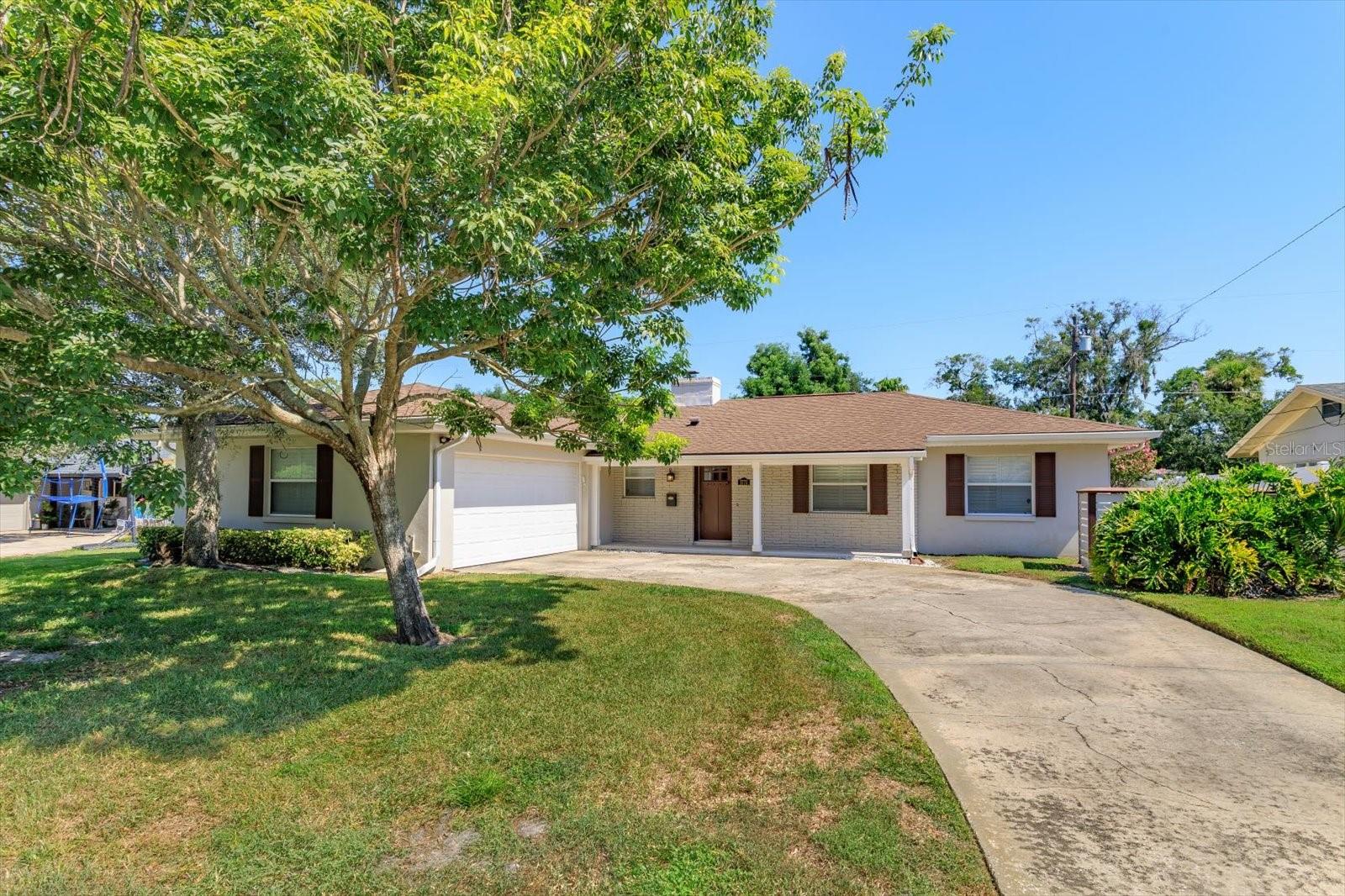 Charming home in sought-after Dommerich neighborhood of Maitland! On the market for the first time since 1960s!! This well-loved home is ready for your personal touch. Located in one of Maitland's most desirable low-density area, this 2-bedroom, 2-bath residence offers a rare opportunity - with no pool. It makes the perfect canvas for your creativity, whether you envision expanding the living space, adding a pool, or simply updating with your style. Enjoy beautiful terrazzo flooring throughout, an open floor plan, and abundant natural light streaming through large windows. The cozy living room fireplace adds warmth and character, while plantation shutters on the front windows create classic curb appeal. Important updates include: electrical panel; air-conditioning; roof; plumbing; windows; gutters; crown-molding kitchen cabinets plus matching backsplash; and an unique side-entry 2-car garage with both washer and dryer included. The master suite features a spacious sitting area - formerly a third bedroom - which offers great flexibility for a home office, nursery, or reading/drawing nook. The large fenced backyard is ideal for entertaining, playing, or adding a custom pool. Relax on the charming front porch, perfect for evening chats with neighbors. Just a short walk to Dommerich Elementary and Maitland Middle, and zoned for top-rated Winter Park High School. Residents also enjoy Maitland Community Park with walking trails, a playground, and private access to the Chain of Lakes. Don't miss this special opportunity to own in one of Central Florida's most beloved communities!