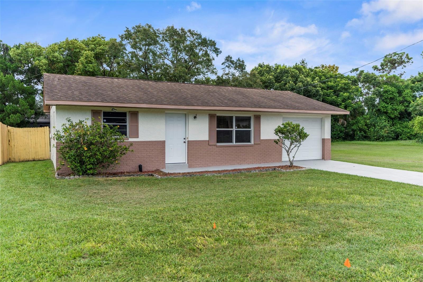 LOCATION, LOCATION, LOCATION!!! Welcome Home to the Sea Pines Community! NO HOA!! NO CDD!! Close proximity to SunWest Park, offering a beach, restrooms, park, and the Lift Adventure Park!! This 2 Bedrooms, 2 Bathrooms, 1 car garage home is situated on a double lot giving you .35 acres with space to add an additional garage/workshop to house your boat. The backyard is fenced with a shed for extra storage. Large patio slab right outside the backdoor off the kitchen. New front, back, and interior door to the garage (6/2025), Garage Door (2/2013), New Ceiling in Garage (2022), Roof (2014), Well Pump (2018), Water Softener (2019) some windows have been replaced. Exterior Paint (2023). Public water/sewer with newly paved road will be done with the option to hookup to it. This home is close proximity to community boat ramp, restaurants, medical, shopping. There is some floor damage from removal of safe in one of the bedrooms. The seller is repairing this. This is a fantastic opportunity to own a home in the sought after Sea Pines Community with a double lot. PER SELLER THIS PROPERTY HAS NEVER FLOODED!!!