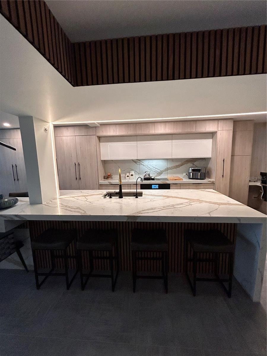 Experience modern coastal living at its finest in this completely remodeled condo, updated from top to bottom with brand-new plumbing, electrical, and a fire sprinkler system. Designed with today’s lifestyle in mind, this residence is equipped with automatic hurricane shutters and cutting-edge smart home technology that extends to the cabinetry, kitchen systems, and more. The chef’s kitchen showcases top-of-the-line JennAir appliances, including a built-in coffeemaker, blending elegance with functionality. Sleek contemporary finishes complement the open layout, while your private balcony offers breathtaking Gulf views. Every detail has been thoughtfully curated, making this beachfront retreat truly turn-key and ready for you to enjoy.
