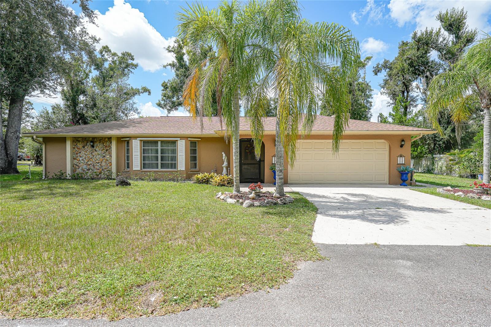 From the moment you pull up, this home just feels warm, welcoming, and full of life. It’s the kind of place that has been loved by the same owner since day one, and now it’s ready for you to make it your own. With three bedrooms, two bathrooms, and a two-car garage, this solid concrete block home has space for everyone and everything. Picture this: mornings spent in the formal living room with sunlight pouring in, afternoons gathered in the oversized kitchen while something delicious is in the oven, and evenings curled up in the bonus family room with the wood-burning fireplace glowing in the background. The dining room is just waiting for Sunday dinners and holiday celebrations, and the huge Florida room is the perfect spot for game nights, lazy Saturdays, or keeping the windows open to enjoy the breeze. Out back, the yard yard is where the real magic happens. Guests or pets can play freely while you relax under the gazebo with a cold drink in hand. The landscaping is lush and established, so you can spend more time enjoying it and less time working on it. All of this sits on a corner lot, giving you extra breathing room and privacy. And when you’re ready to venture out, you’re just minutes from local schools, shopping, and the charm of Arcadia’s famous downtown district, where you can grab coffee, browse the shops, or enjoy a night out. Life here feels easy, comfortable, and connected. All that’s missing is you.