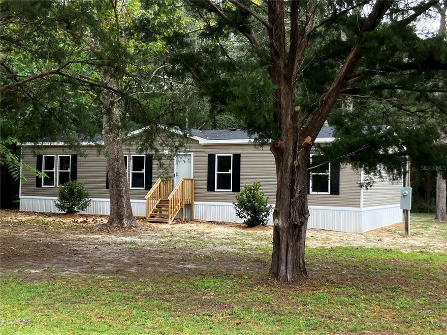 Brand new 4 Bedroom/2 Bath Manufactured Home. This floor plan has distinct spaces with an open flow. Double windows throughout feel bright and welcoming. Nice room sizes and a huge Master closet for extra shoes or extra storage. Big utility room for multiple appliances and more storage. New well and septic. This house is ready when you are! Owner is licensed real estate agent in Florida.