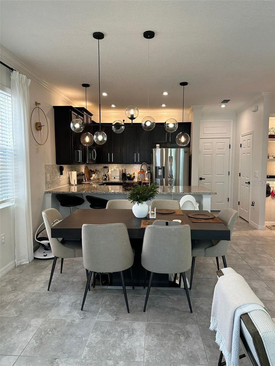 Photo of 2433 Varenna Loop, Kissimmee, FL 34741 (MLS # O6450431)