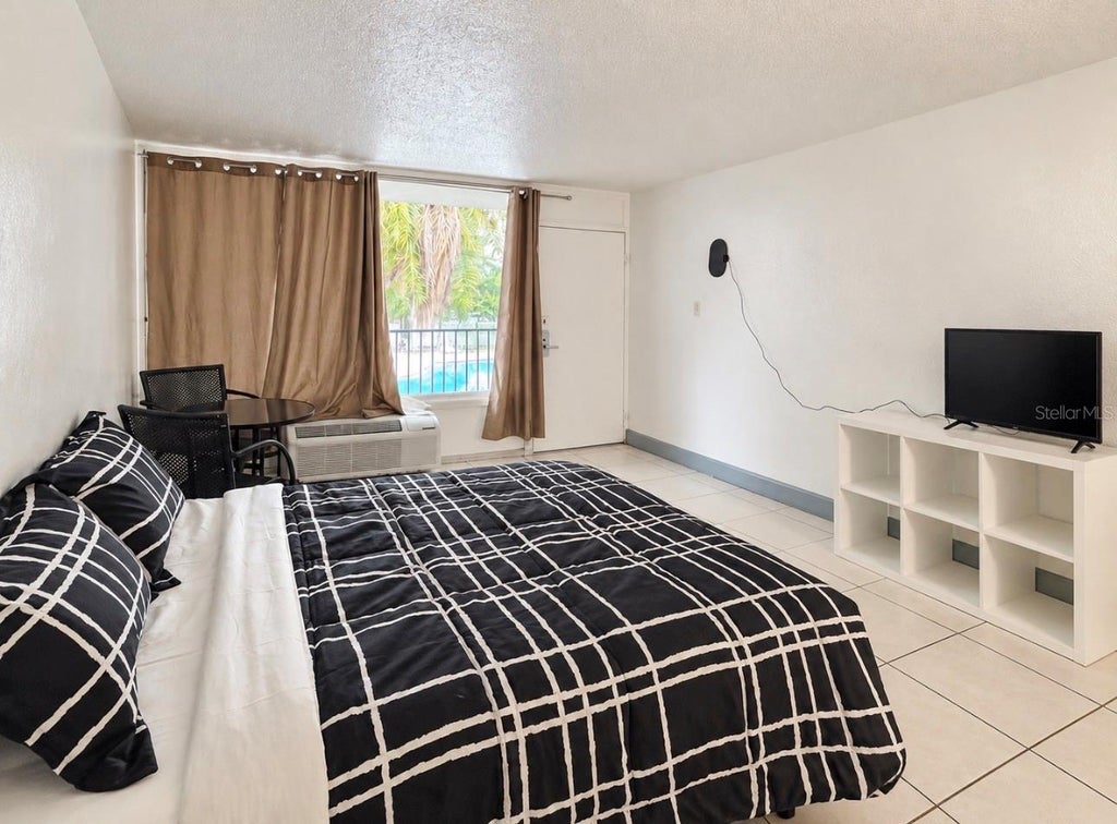 Photo of 7900 S Orange Blossom Trail #2002, Orlando, FL 32809 (MLS # S5157858)