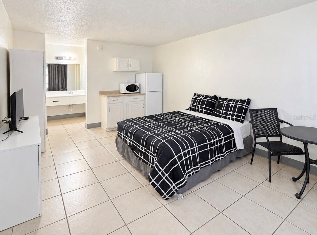 Photo of 7900 S Orange Blossom Trail #2002, Orlando, FL 32809 (MLS # S5157858)
