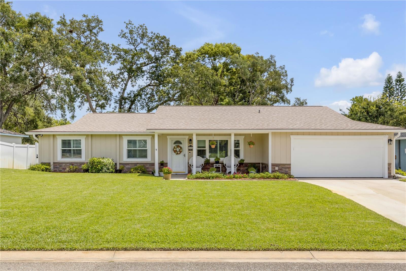 Move-in ready alert!! This delightful property is perfectly located in the heart of Ormond and just a few miles from the beach! Enjoy the peace of mind that comes with a meticulously maintained home featuring several recent upgrades. Step inside to discover a welcoming interior with plantation shutters and Pergo flooring throughout. The spacious living areas are perfect for both relaxation and entertaining. The kitchen boasts all new appliances as well as open access to both dining and living areas. Stay cool in the summer months with a new AC system installed in 2025 and feel secure knowing the roof was replaced in December of 2024. Additional improvements include, new ductwork installed in 2023, hot water heater (2022), ensuring your home runs efficiently for years to come. Experience outdoor living at its finest. The enclosed porch is a cozy spot to unwind, while the fully fenced yard provides ample privacy and security. Both bathrooms have been completely redone with updated tile, vanities and fixtures. One of them is equipped with a Jacuzzi tub for ultimate relaxation! Added safety and convenience include hurricane windows and an ADT security system already in place to protect your home. This home not only offers modern conveniences but also a prime location, close to restaurants, shopping and the ocean! Schedule a tour today to personally discover the exceptional qualities of this property!