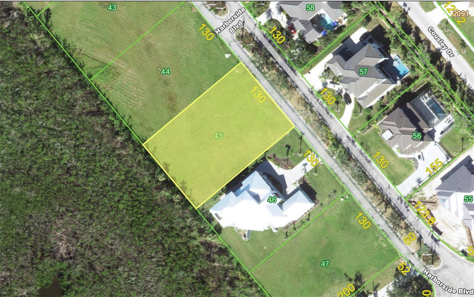 Welcome to Grassy Point with its beautiful oversized estate lots, private gated entrance, and exclusive marina. This unique community is located directly on Charlotte Harbor. Build your dream home on a 130x200 lot (0.6 acres) The rear of the property faces protected state wetlands offering privacy and a beautiful view. This property comes with a DEEDED DOCK (B-15) in the community marina. Immediate sailboat access to Charlotte Harbor and on to the Gulf of Mexico. GRASSY POINT ESTATES is a deed restricted community with clubhouse, lush tropical landscaping, full time manager, and 24 hour security guard at the entrance. Minutes from shopping, dining, entertainment, medical care. This is a great location in a very special community.