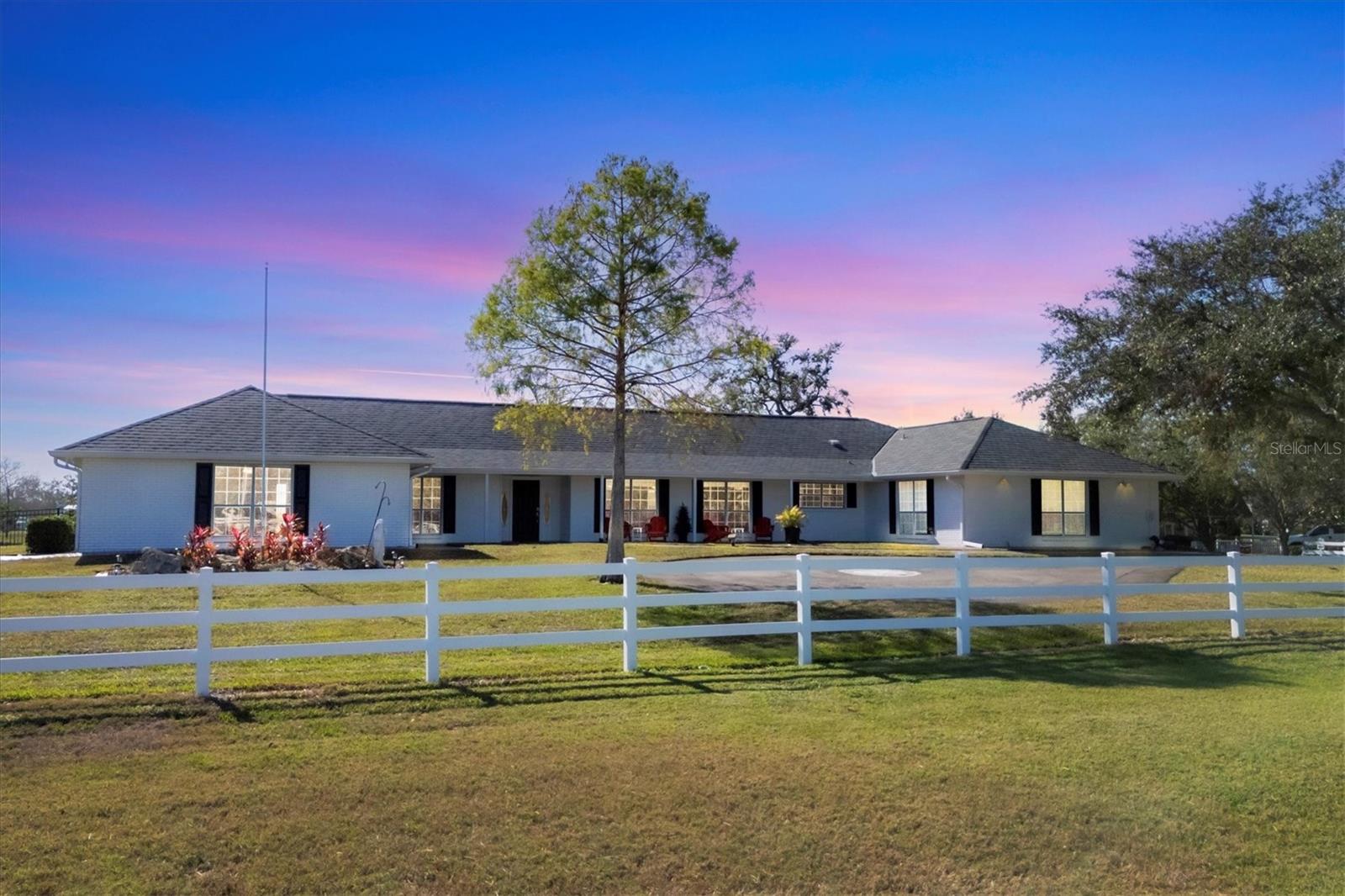 Luxury Ranch-Style Retreat on Over 4 Acres with Heated Pool & Serene Lake Views... Don't miss your chance to own this charming 4-bedroom, 3-bathroom ranch-style home nestled on over 4 acres of pristine land in the heart of Palmetto, Florida. The property boasts unparalleled privacy and scenic beauty! This home’s open floor plan seamlessly flows from the elegant dining area to the stunning kitchen. Equipped with granite countertops, a spacious kitchen island, under-mount cabinet lighting, a breakfast bar, and a large pantry, this kitchen is both functional and stylish, overlooking the light-filled living area. The owner's retreat is a true sanctuary, featuring two walk-in closets and a luxurious en-suite bath with modern double vanity sinks and a beautifully tiled walk-in shower. With an abundance of natural light and thoughtful design, this home offers both comfort and style at every turn. Step outside to the covered, screened-in lanai, where you’ll find a heated in-ground pool, perfect for relaxing and entertaining with family and friends. The expansive outdoor space is fully fenced, offering privacy and multiple gates for easy access. Additional features include crown molding throughout, an indoor washer and dryer with a utility sink and cabinets for extra storage, and the tranquility of owning multiple acres of land. Listing price and sale includes all 3 property ID #'s: 2415411259,2415411209,2415411309. There are some minor deed restrictions relating to fence height and building size for vacant lots. This exceptional property offers a rare combination of luxury, functionality, and natural beauty—schedule your private tour today and make this dream home yours! NOTE: Property Information received from third-party sources is considered reliable but is not guaranteed. All information should be independently verified by buyers and buyers' agent.