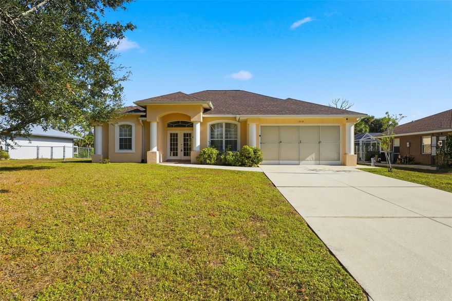 If you’ve been wanting more room to spread out—inside and outside—this North Port home makes it easy to imagine everyday life feeling calmer and more spacious. NO HOA, X FLOOD ZONE so no flood insurance requirements!

Nearly 2,000 sq ft gives you defined areas to come together, and plenty of room to retreat when you want quiet. The split-bedroom layout means everyone has privacy, and the main living spaces open toward the water, so you’re always aware of the peaceful canal just beyond the backyard.

The kitchen sits at the center of the home, connecting the family room, dining area, and the back porch. You can cook while chatting with guests, keep an eye on the water, or enjoy breakfast with the sliding doors open on cool mornings. The primary suite sits on its own side of the home with water views, a walk-in closet, and a private bath. The additional bedrooms and guest bath give family or visitors their own comfortable corner of the house.

Step outside and the canal becomes part of your daily routine. Some afternoons might be spent fishing from your own backyard. Other days you may grab a kayak and quietly explore the waterway, spotting wildlife and enjoying the stillness. Evenings are for sitting on the porch and listening to the breeze move through the trees.

Living here also puts you close to everything North Port residents love—nature parks, kayak launches, playgrounds, and long walking trails. The Aquatic Center, Warm Mineral Springs, golf, local restaurants, farmers markets, and everyday conveniences are all just a short drive away.

With no HOA and a location near schools, parks, and coastal spots, this home gives you room to grow, room to relax, and a peaceful waterfront backdrop you get to enjoy every day.