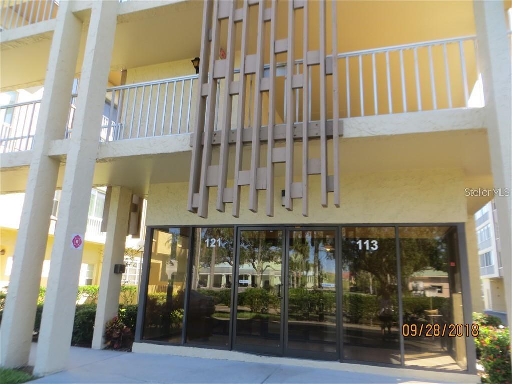 Beautiful updated 2/2 condo on Island Estates right across the street from Publix and Restaurants. This 3rd floor unit is on the top floor beautifully updated unit with new gray tone porcelain tile throughout the unit. The new wood kitchen with Corian countertops and stainless-steel appliances just sparkle. New windows and blinds in the condo make it energy efficient. The enclosed porch was opened up to give you more living space. The bathrooms also have been updated. Northing has been missed in this move in ready condo. It's light and bright and is waiting for you. There is under the building parking with a good size storage area. This complex is on the intercoastal with the pool overlooking the water. It’s a 55 plus community.
