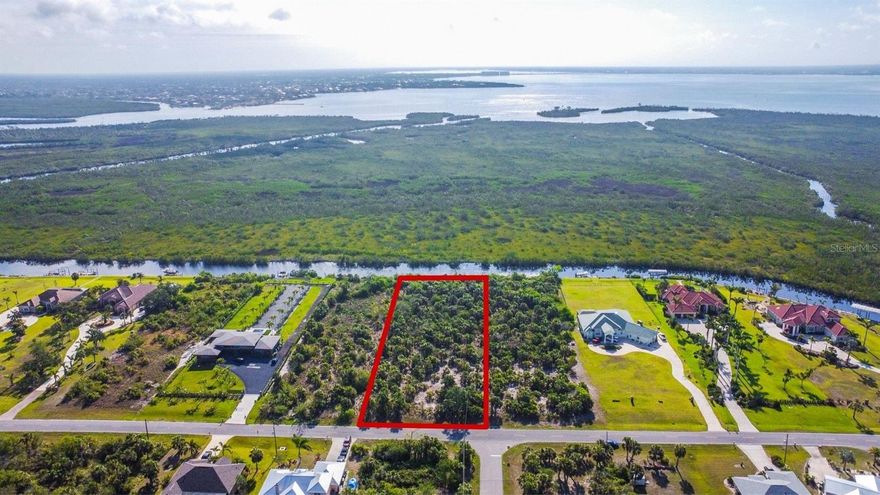 Prime building lot for your personal estate!  130 feet of sailboat waterfront with state owned preserve across the canal so privacy abounds!  Fifteen minutes by boat to Charlotte Harbor.  Lots of room for pool, dock and boatlift.  All this with close access to all local amenities and beaches. Manchester Estates by-laws require homes to be greater than 3,000 sq ft and do not allow subdividing, outbuildings or mobile homes.  Deed restricted with no HOA fee.  Home sites like this are not easy to find!