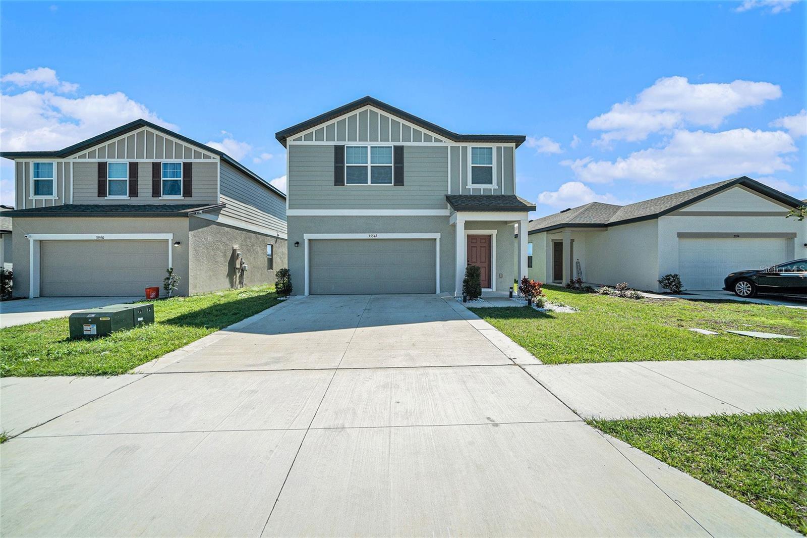 Welcome to 35542 Buttonweed Trail, a contemporary two-story residence built in 2023, nestled in the serene community of Hidden Creek in Zephyrhills, Florida. This meticulously designed home offers 3 spacious bedrooms, 2.5 bathrooms, and encompasses 1,826 square feet of living space. Interior Features: Upon entering, you're greeted by an open-concept floor plan that seamlessly integrates the living, dining, and kitchen areas, creating an inviting atmosphere ideal for both relaxation and entertaining. The modern kitchen boasts stainless steel appliances, ample cabinetry, and a large island, catering to culinary enthusiasts and casual diners alike. The expansive master suite features a walk-in closet and an ensuite bathroom with dual vanities and a luxurious shower. Additional bedrooms are generously sized, offering comfort and versatility. Exterior and Community Amenities: The property includes a two-car garage and a well-maintained yard, providing outdoor space for leisure or gardening. Residents of Hidden Creek enjoy access to community amenities such as a playground and a pool, enhancing the neighborhood's appeal. Local Dining and Shopping: Situated in Zephyrhills, this home is in proximity to a variety of dining and shopping options. Notable nearby restaurants include: • Sunrise Eatery: A local favorite known for its American cuisine and hearty breakfasts. • The Great Catch - Zephyrhills: Offers a delightful seafood menu in a casual setting. • Best Thai & Sushi: Provides an array of Thai dishes and sushi options, catering to diverse palates. For shopping needs, residents can visit the nearby Wiregrass Mall, featuring a wide selection of retail stores, dining establishments, and entertainment venues. Additionally, the historic downtown Zephyrhills area offers unique boutiques and local shops, enriching the community's charm. Conclusion: 35542 Buttonweed Trail presents an exceptional opportunity to own a modern home in a welcoming community, with convenient access to local amenities, dining, and shopping. Experience the blend of comfort, style, and convenience this property has to offer.
