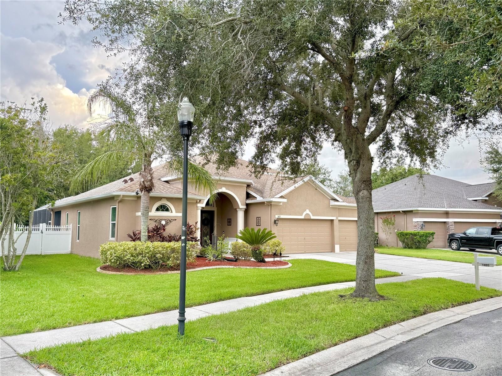 ASSUMABLE VA LOAN AT 1.75%! This exquisite 5-bedroom, 4-bathroom home with a private pool is situated on a .294-acre premium-conservation lot in the Diamond Hill Gated Community. The home's two-story design features the primary bedroom, a second bedroom, an office, and 2 full baths on the first floor; with an additional 3 bedrooms, 2 full baths, and a versatile bonus/flex space upstairs. Upon entering through the striking double, leaded-glass front doors you're greeted by decorative arches, upgraded lighting, and continuous tile flooring that flows throughout the common-area of the entire first floor. The foyer opens into a spacious living and dining area, leading to a gourmet, eat-in kitchen equipped with 42" cabinets with crown molding, beautiful Corian countertops, built-in oven, beautiful backsplash with a pot-filler faucet, and a breakfast bar perfect for family or guests. The kitchen cabinets feature soft-close doors, with lower cabinets also featuring sliding chrome shelving. A charming office on the main floor features an entire wall of built-in custom shelving. The primary suite offers two walk-in closets with built-ins. Four sliding doors lead to a beautifully resurfaced, screened lanai and pool where you can enjoy ample space for dining, entertaining, or simply relaxing; or step further outside into your beautiful, fenced yard. Numerous updates done for you – 2 retractable awnings on lanai, fenced yard with 3 gates, mature landscaping with fruit trees, gutters, blinds, and ceiling fans all installed; HVACs replaced in 2017 and 2020 ($11k), roof replaced and two solar attic vents added in 2021 ($21k), lanai resurfaced and all sliding doors replaced in 2023 ($36k), and in 2025 the back door and all windows (23) were replaced, the pool cage was rescreened, and the house was painted ($37k). This tech-enhanced home has wireless burglar, smoke, and fire alarms, Ring doorbell and camera, plus more than 30 motion and/or voice-controlled switches and lights. These can stay or be removed, buyer's choice. All kitchen appliances, garage freezer, outdoor storage sheds, and most lanai furnishings convey with the home. The sellers invite you to schedule an appointment for your private tour of their updated, beautiful home.