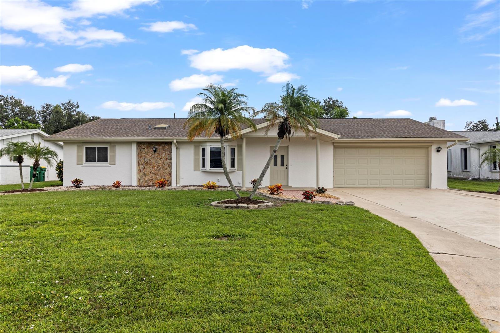 This charming home features 2 bedrooms 2 bathrooms 2 car oversized garage. New Paint inside and out for your convenience. This one checks all the boxes. This home is ideal for first time home buyers or anyone looking for a coastal retreat. featuring just over 1800 square feet of living space, plus a huge screened in lanai and extra patio area to enjoy your morning coffee or entertaining your family and friends. It truly is your private retreat from everyday life. The Master bedroom features it's own private beautifully updated bath with pocket door. The Kitchen features an abundance of counter space and cabinets. The indoor laundry offers everyday convenience, there's even a computer station area just off the kitchen to sit and pay bills or search for a favorite recipe. In addition to your garage for storage, there's a 10 x6 storage shed out back. For you sports fans, Charlotte Sports Park is only approximately 10 minutes away for the Tampa Bay Ray's Spring Training games. Otherwise, your close to golf, fishing, and boating. Come and enjoy your slice of paradise in this affordable costal community .