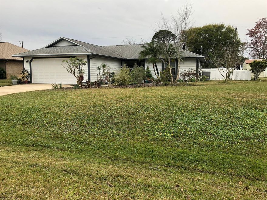 Beautifully maintained home with open floor plan, cathedral ceilings and double hung windows in a quiet desirable neighborhood close to shopping. The kitchen was recently remodeled and includes new cabinets, sink, pullout drawers and corner cabinet that includes a lazy susan for optimal space utilization and convenience. Master bath was also remodeled to create a large closet. Master bath shower is step in with convenient grab rails. Recent painting includes most of home interior and the garage. Floor is tile, laminate and the kitchen has linoleum for easy maintenance. This home has a spacious screened Florida room that overlooks a large fenced in back yard. Utility shed is in excellent condition with electric in place. Included with the home is a 1 year home warranty!
There is a well and sprinkler system that provide for lawn maintenance. There are also two beautiful arbors that add serenity to the back yard. AC in the home has a current maintenance contract. Home has a current transferable termite bond. ;Water: City