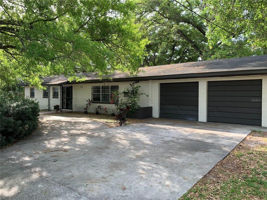 This CI-zoned parcel presents a valuable opportunity in central Tampa, encompassing approximately 17,760 square feet of land suitable for diverse redevelopment projects. Located just east of the Ybor City corridor and minutes from downtown, the property benefits from its ultra convenient access. The site comprises three lots, offering optimal flexibility for business professionals, entrepreneurs, or investors. Commercial Intensive zoning supports multiple commercial activities and a broad range of service uses. Currently, the property includes a three-bedroom, two-bath block home with a spacious two-car garage, making it conducive to live-work arrangements and further enhancing its versatility.