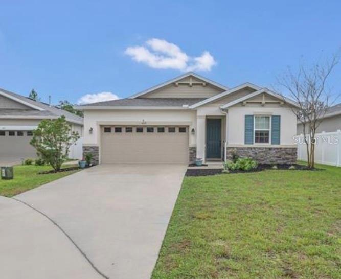 This stunning 4 bedroom, 2 bath home boasts a spacious open floor plan, ideal for both entertaining and everyday relaxation, all while enjoying serene views of the surrounding nature. Built in 2022, this home sits on a breathtaking conservation lot, offering picturesque views from the main living spaces and the master suite. The well-appointed kitchen flows seamlessly into the living and dining spaces, leading effortlessly to the welcoming outdoor covered patio - perfect for outdoor entertainment. In addition to the lovely conservation lot, this home is perfectly situated on a quiet cul-de-sac. The thoughtfully designed layout of this home offers a private primary suite with a spacious walk-in closet. The split floor plan for the additional three bedrooms offers added privacy. The secondary bath also has double sinks, adding both functionality and convenience.
Enjoy the accessible indoor laundry room and ample storage throughout the home. Located near the popular Yalaha Bakery, this home also offers convenience to Hwy 27 and the Florida Turnpike. The low HOA includes common area maintenance, high speed internet and a community playground.
Located in the desirable community of Spring Creek, this home is ideally located close to local schools, parks and shopping. There are plenty of lakes and nearby parks with beautiful trails to spend the day outdoors. The Villages and Leesburg are within 15 minutes, offering all kinds of restaurants and shops - including little boutiques, coffee shops and local breweries.
Don't miss your chance to call this stunning property home! It offers the perfect blend of modern comforts, well designed spaces and peaceful outdoor living! Schedule to see this beautiful home today!