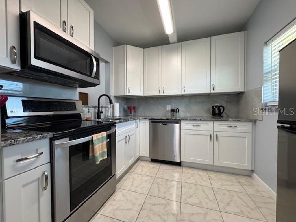 Photo of 11485 Oakhurst Road #319, Largo, FL 33774 (MLS # TB8375368)