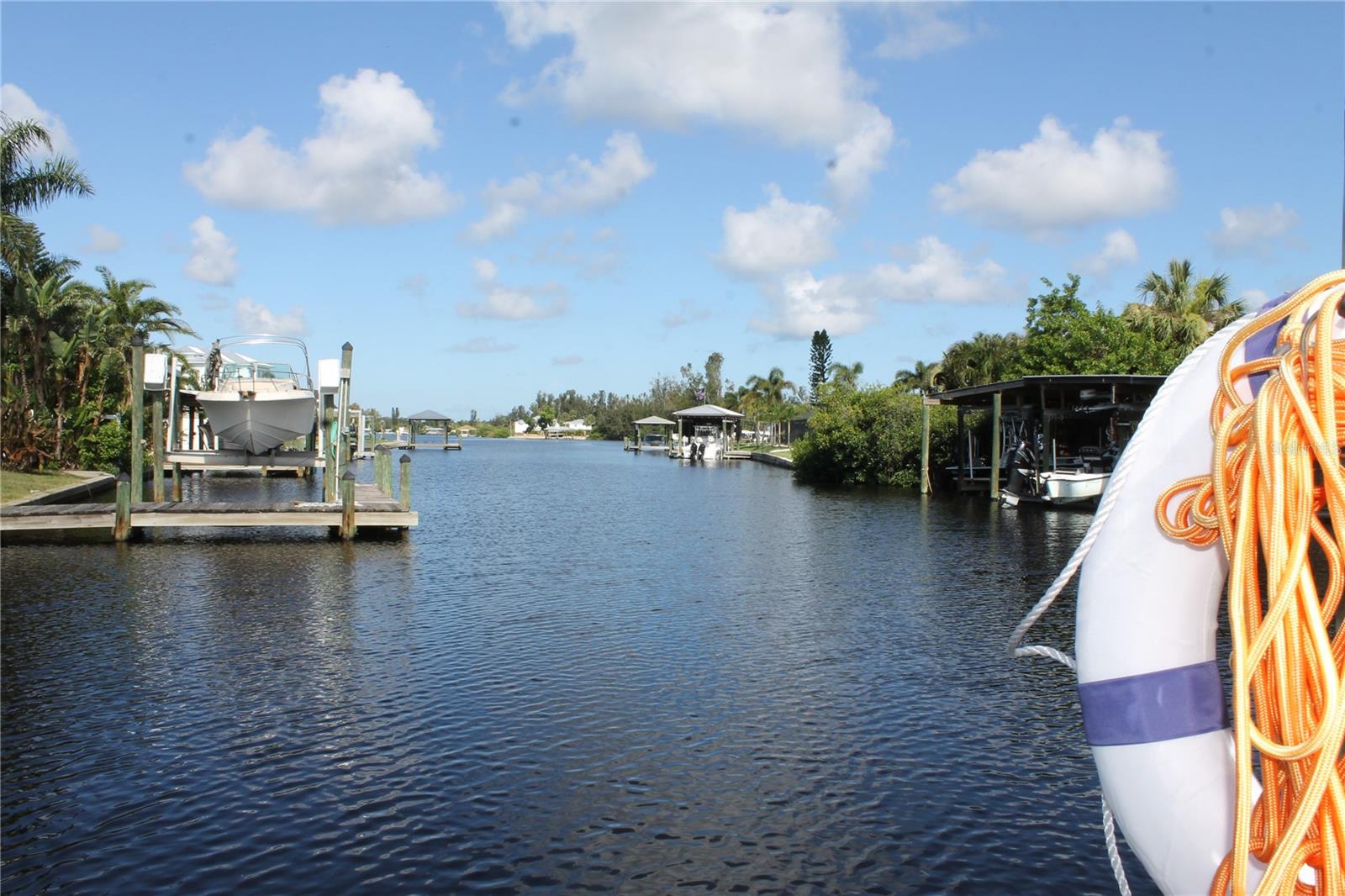 WATERFRONT Fully renovated pool house with state-of-the-art boardwalk and seawall completed in 2024!
4 bedrooms and 3 baths attached to a 2 car garage with no HOA fees. Formal living room and additional family room. Step through the beautiful double-door front door to your luxurious dream home through a family room that flows into the formal dining room that features a wine cooler and bar with soft-close cabinetry and counter space for entertaining. The luxury kitchen features a bar with seating, a deep stainless-steel sink and extended gooseneck to fill large pots, stove top with dual heating options, a built-in microwave and convection and regular oven, and a smart refrigerator that speaks to you. The living room has cozy seating off the kitchen with space for an office workstation or eat in kitchen seating area and features a stone electric fireplace. Dual ceiling fans and LED recessed lighting throughout. The laundry room has a smart washer and dryer with extra counter space with dual folding drawers for extra storage and a deep sink.
Roof, water heater, air conditioning and pool rebranded in 2022 with a new pool pump in 2024. Screened backyard Patio to sit and watch the water and a fully fenced backyard with side access to store a boat or RV trailer.
Enjoy the pool and gazebo for outdoor entertainment and relax on the deck to watch the sunset. Bring your boat with easy access to Tampa Bay -15 minutes away or simply cast the fishing line from the new seawall built in 2024 or bring the Kayaks or Jet skis. The backyard has been landscaped to include a 4-foot wide paver walkway with lighting from the pool deck to the new composite dock. Enjoy a fire pit with a cobblestone walkway and an extra-large grass lawn for play or pets to enjoy.
Rented as an AirBnB most of the year. All information regarding school zones must be verified. The owner is a licensed real estate broker