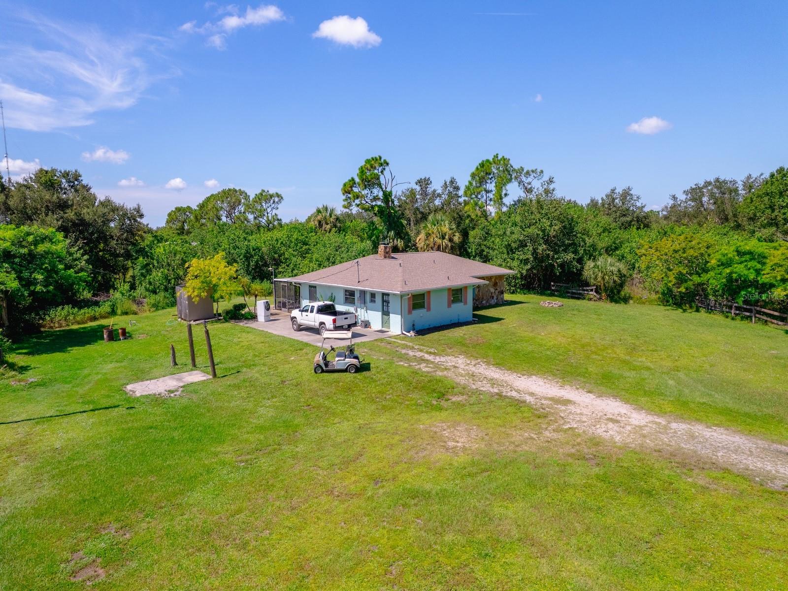 Welcome to 24517 Nova Lane, a rare 3-bedroom, 2-bath home on 4.53 acres in the heart of Port Charlotte. This unique property combines comfortable living with incredible space and versatility, offering the best of both privacy and convenience. Step inside to find a functional layout with bright living areas, a spacious kitchen, and three comfortable bedrooms. Outside, the property is truly a standout featuring a detached garage/workshop perfect for hobbies, storage, or small business needs, along with a detached horse building complete with stalls and a tack room for equestrian enthusiasts. With over 4.5 acres of land, there’s plenty of room to expand, garden, or create your dream outdoor oasis. Despite its private setting, this property is just minutes from shopping, dining, medical facilities, and all the amenities Port Charlotte has to offer. Whether you’re looking for a family home with space to grow, a mini-farm setup, or a versatile property close to town, 24517 Nova Lane is a must-see.
