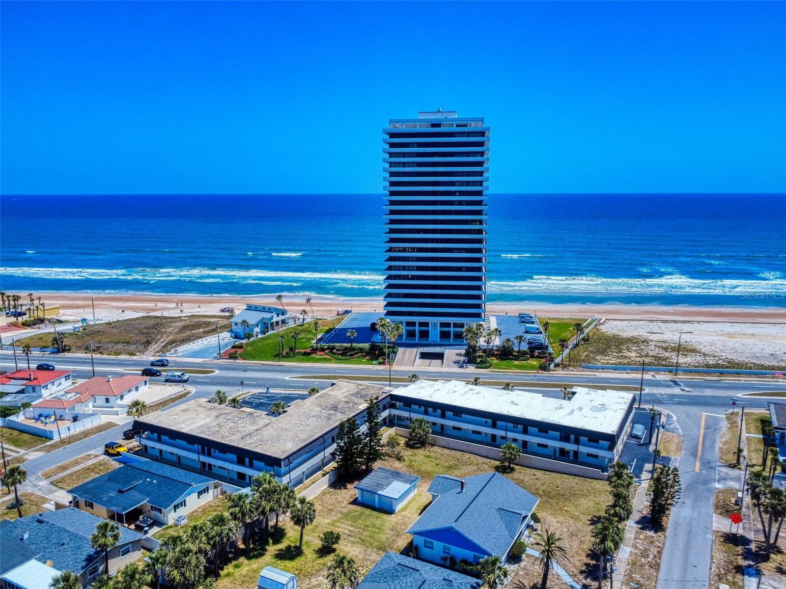 Ocean Views from balcony/greatroom. Spacious 1 bedroom unit with open floor plan boasting beautiful ocean views and breezes. Short walk to the famous DAYTONA BEACH sandy shores. So many attractions, shopping venues and fabulous dining options after your day at the beach. Complex has just finished a total facelift and upgraded hurricane windows to this perfect island retreat. All the bills are paid and the small friendly complex is ready for your relaxing life style. Owners have pets. Rental income a possibility. Low HOA and reserves are flush. Parking is assigned, plentiful and convenient off street.