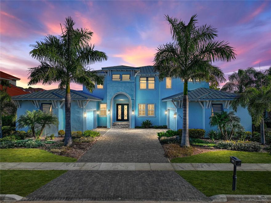 Absolutely pristine 6BR/4.5BA pool home, canal waterfront property located in the highly desirable gated community of Mirabay. Absolutely move-in ready. Upon entry through the brand new in 2023 hurricane rated double front doors, you will find a stunning view towards the pool and canal waterfront!  Wood flooring greets you and runs through the home. Entering you will be greeted with  the formal Living Room with a beautiful architectural ceiling and triple sliders guiding you out back towards the lanai.  To your immediate left is the office with an abundance of cabinet space and built-in desk. Moving towards the left hall, you will find two bedrooms. One of the bedrooms you will view includes an En Suite bath as well as a walk in closet, perfect for a multi-generation or in-law suite.  The right side of the home features the formal Dining Room which leads into the gorgeous Kitchen. Featuring double islands, quartz counters, a walk-in pantry with wood shelves, soft close cabinets and drawers, reverse osmosis at the kitchen sink, and wet bar with beverage fridge between the Kitchen and Dining room, this room has it all! Boasting under cabinet lighting, fold-away water faucet over the convection oven, additional storage for small appliances, Café stainless gas convection double oven, Café stainless refrigerator, farmhouse sink, and beautiful herringbone tiled backsplash, this Kitchen will be the center of all get-togethers. Off the Kitchen is the Great Room, perfect for entertaining with surround sound, and french doors and a half bath leading to the lanai. Moving up the stairs, immediately to your left is the grand Primary Bedroom complete with a huge balcony overlooking the pool and canal out back and full En Suite bath. The En Suite is an oasis featuring a walk-in closet with built-ins, huge walk-in shower with 2 stationary shower heads and 2 hand-held shower heads, stand alone bathtub, dual-sink vanities with backlit smart mirrors, under cabinet lighting, and additional cabinetry. Further down the hall, there are 3 bedrooms.  In between two of the bedrooms features a stunning Jack and Jill bathroom. Making your way toward the end of the hallway upstairs you will be greeted with the 4 bedroom as well as another full bathroom and the second laundry room. Out back will become your sanctuary with a fully screened lanai, built-in outdoor gas grill, outdoor kitchen with sink and mini-fridge, fully pavered pool deck, and heated salt-water pool and spa with sun shelf and pool lights controlled via remote. There is also a wood dock with electric and water supply for access to the canal. Multiple upgrades throughout the home to name a few include hurricane rated windows,  7" crown molding as well as 7" baseboards, 5" plantation shutters, water softener in garage, and sealed garage floors for both garages. BOTH laundry rooms (upstairs and downstairs) include a wash sink and cabinets for storage. If you are looking for an active community Mirabay is waiting for you!  Mirabay is the place to be with the resort style community pool, fitness center, tennis club, pickleball club, mariners club, anglers club, basketball courts and so much more.  See for yourself why you want to live here and contact me today.