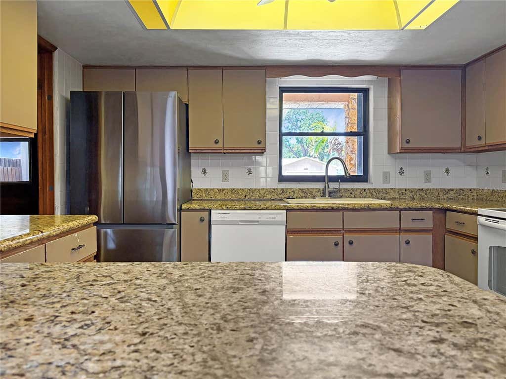 Photo of 2417 Travelers Palm Drive, Edgewater, FL 32141 (MLS # O6418971)
