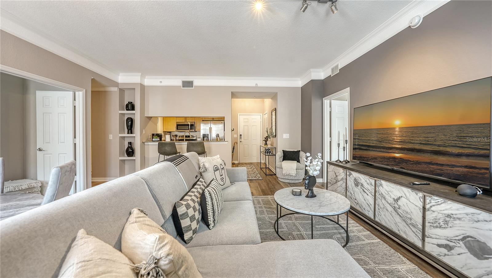 AVAILABLE NOW TURNKEY FURNISHED 2/2 luxury condo on the 5th floor of Broadway Promenade, unit 1522. Condo MAY BE AVAILABLE FOR LESS THAN A YEAR TERM. Beautifully renovated and designed with modern touches, it is bright and comfortable with a floor plan that is open and inviting. The kitchen features granite countertops, a pantry, and a breakfast bar, The expansive master suite features a walk-in California closet and a private balcony overlooking the courtyard. The ensuite master bathroom features a soaking tub and a separate standing shower. A friendly and helpful staff is available 24/7, along with concierge services in this secure building offering assigned underground parking and a separate storage area. Community heated resort style pool and spa, BBQ grills for outdoor dining and entertaining, fitness center with locker rooms and a sauna, and a library. There is a business center with a computer, printer, and WIFI, billiards room, a conference room, social room with big screen TV, bar area and full kitchen, and game room (ping pong and cards). Tennis courts are conveniently located across the street in Pioneer Park. Three guest suites are available for visiting friends and family. Publix is just outside your front door, and you are across the street from a waterfront park by the SARASOTA BAY with a boat ramp. Close to downtown with fine and casual dining, shopping, Van Wezel Performing Arts Hall, the opera, library, and Players Community Theater are just around the corner. Close to St Armand’s Circle, and Lido Beach. Take a scenic walk over the Ringling Bridge to Bird Key/St. Armand’s Circle. Don't miss this one CALL TODAY! Sorry, no smoking or pets not allowed for the homeowners' association. Approval may include an application, background screening, fees, and an approval process. Broadway Promenade requires a $750 common area security deposit. Contact the agent for details. Note: No smoking allowed (HOA regulations).