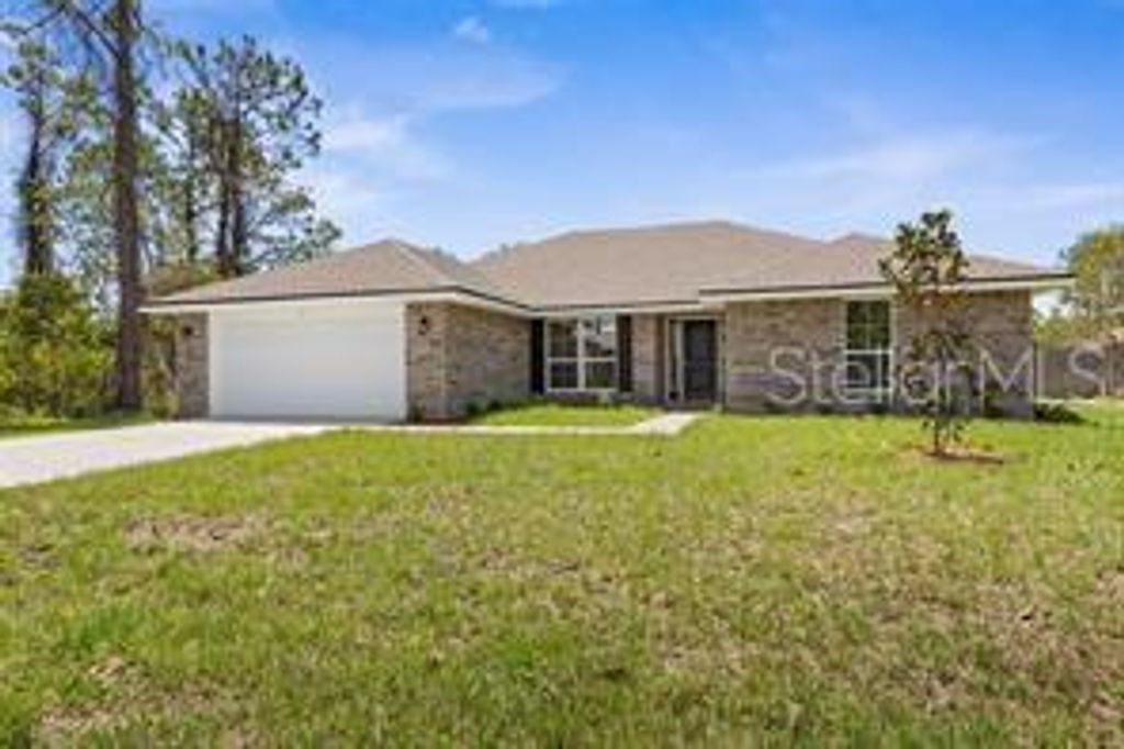 Photo of 142 Pine Grove Dr, Palm Coast, FL 32164 (MLS # FC313550)
