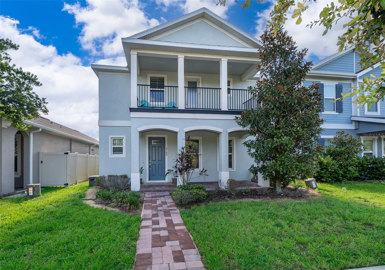 COME set your eyes on this gorgeous 2-Story Winter Garden Home located in Highlands at Summerlake Groves! As soon as you walk through the front door you'll notice the Tall 9 ft Ceilings and see the Openness in the Large Living Room, Dining Room, and Kitchen area that is all open, light & bright with tons of windows and a Sliding Glass Door leading out to your Back Porch with Pavers and Fenced-In Back Yard. The Kitchen comes equipped with Granite Countertops, all Stainless Steel GE Appliances including Fridge, Gas Stove, Built-In Microwave, NEW Dishwasher, Large Granite Island with Sink and a nice Backsplash in a Herringbone pattern. The Primary Bedroom and Two More Bedrooms are located Upstairs with the Split-Bedroom Floor Plan along with a Second Living Room on the 2nd Floor for all your family's needs. The Primary Bedroom features an En-Suite Bathroom with Large Shower, Double Sink Vanity, Walk-In Closet, and a Private Balcony! All of the Upstairs has NEW Carpet by SHAW. Inside Laundry Room is located on the 2nd Floor. Tankless Water Heater. The HOA features: Swimming Pool, Playground, Tennis Courts, and Dog Park. Golf Carts are Welcome. Neighborhood is close to the Orange County National Golf Course which is a public golf course. Close to Hamlin that features lots of Restaurants, Shops, Publix Grocery Store, Wal-Mart, a Movie Theatre and more! Don't miss your chance to make this house your home!