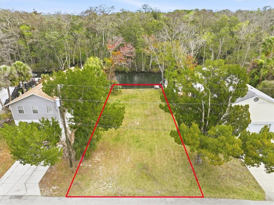 Discover the boating lifestyle you’ve been dreaming of with this rare Weeki Wachee River canal residential building lot in the heart of Weeki Wachee Gardens.

This 50 x 100 lot offers 50 feet of waterfront on a Weeki Wachee River canal that leads directly to the crystal-clear Weeki Wachee River and ultimately out to the Gulf of Mexico with no fixed bridges. Bring your flats boat, center console, or deck boat and enjoy true Gulf access right from your future backyard.

What makes this homesite even more special? Across the canal is protected marshland, giving you wide-open natural views instead of neighboring homes. Imagine building your elevated Gulf Coast fishing retreat where your back porch overlooks peaceful marsh habitat, coastal birds, and glowing sunset skies.

Welcome to Weeki Wachee Gardens — a charming, spring-fed riverfront community tucked away in Hernando County, just about an hour north of Tampa via the Suncoast Parkway. Hidden from the congestion of US-19 and SR-50, this neighborhood feels like stepping back into Old Florida.

At the heart of the community flows the legendary Weeki Wachee River — a 7.5-mile, spring-fed river that maintains a refreshing 74-degree temperature year-round. The river begins at iconic Weeki Wachee Springs State Park, famous since the 1940s for its live mermaid shows and underwater theater. The springs produce more than 112 million gallons of crystal-clear water daily, creating one of Florida’s most beautiful and navigable spring systems as it winds its way toward the Gulf near Bayport.

Life here revolves around the water:

* Cruise the river with friends and family
* Fish for redfish and snook as you head toward the Gulf
* Scallop, snorkel, and dive in nearby Gulf waters
* Paddle the clear spring run by kayak or paddleboard
* Watch manatees glide through the river in cooler months

This is a place where mornings begin on the water, afternoons are spent fishing or exploring, and evenings end with marsh sunsets and quiet coastal breezes.

If you’ve been searching for the perfect place to build your custom Gulf Coast fishing home with direct Gulf access, natural views, and true Old Florida charm — this is it.

Build your waterfront dream and start living the Weeki Wachee River lifestyle.