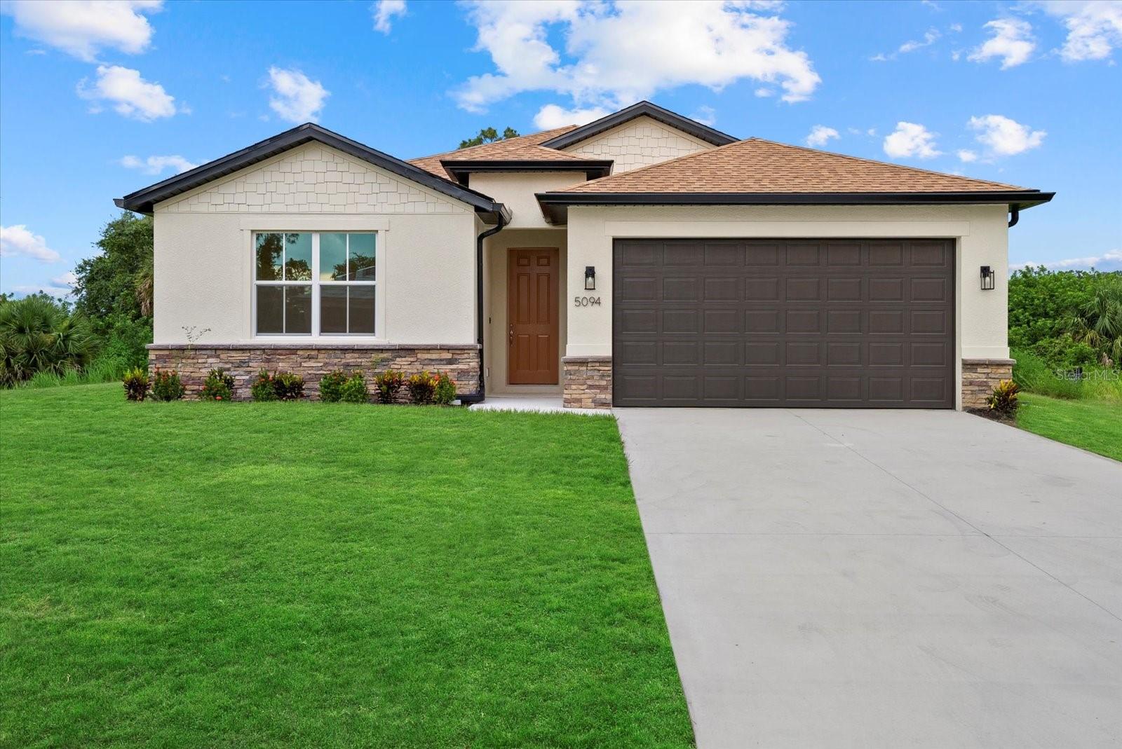 New Construction! Move-in Ready! This beautiful 4-bedroom, 3-bathroom home with a 2-car garage is ready for you to call home. Step inside and be greeted by the spacious great room with soaring 9'4'' ceilings and elegant 8' doors throughout. The modern kitchen INCLUDES a stainless-steel Samsung appliance package, beautiful quartz countertops, and an open layout perfect for entertaining. The Primary bedroom comes complete with a tray ceiling, dual walk-in closets, and a spa-like ensuite with double vanities. The fourth bedroom, located at the front of the house, offers privacy with its own ensuite bathroom, perfect for guests or extended family. This home is packed with high-end finishes, including hurricane-impact windows, tiled showers, stylish and durable flooring, irrigtion system, and a Ring doorbell. Enjoy Florida living year-round on the covered lanai, ideal for outdoor relaxation. Selling concessions are available to make your move even easier! No HOA fees, no CDD. Interior photos are from a another home with the same floorplan and finishes. Schedule your showing today!
