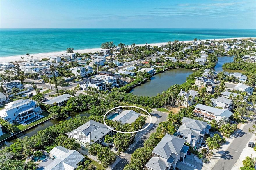Located on the highly sought-after North End of Anna Maria Island, 115 Los Cedros—known as Oceans Blue—offers an exceptional location just steps from the Gulf beaches and the shops and dining of Pine Avenue.

Set on a 10,000 square foot lot, this single-story Anna Maria Island beach house combines luxury, comfort, and peace of mind. The residence currently offers four bedrooms, with the flexibility for a possible fifth bedroom, along with 3.5 baths, including two ensuite bedrooms and an additional half bathroom that is ideal for guests. An additional 706 square feet of added living space creates a spacious and functional layout well suited for a primary residence, vacation home, or investment property.

The light-filled interior showcases vaulted ceilings, terrazzo floors, and an open-concept design that flows seamlessly to the outdoor living areas. The updated kitchen features new shaker-style cabinetry, quartz countertops, custom tile backsplash, and stainless steel appliances, ideal for entertaining after a day at the beach.

Expansive sliding doors open to a private outdoor oasis with a resort-style saltwater pool, swim-up sun shelf, and heated spa, surrounded by lush tropical landscaping and professional lighting. Enjoy peaceful mornings and sunset evenings from your private deck overlooking Lake Marsha, offering a rare waterfront setting for kayaking, fishing, or relaxing.

This meticulously upgraded Anna Maria Island beach house includes a new metal roof, hurricane impact-rated windows, sliders, and exterior door, and fully renovated bathrooms with custom tile, glass shower enclosures, and Kohler fixtures. The home is fully flood-protected with a hammerhead flood barrier system on all sliders, exterior door and windows, providing added security and confidence for coastal living.

Whether used as a primary residence, vacation home, or investment property, Oceans Blue at 115 Los Cedros offers a rare combination of location, 10,000 square foot lot size, flexible bedroom configuration, added square footage, luxury upgrades, and comprehensive flood protection—just moments from the beach and the vibrant energy of Pine Avenue on Anna Maria Island. ** Property information received from third-party sources is considered reliable but is not guaranteed. All information should be independently verified by buyers and buyer's agent.