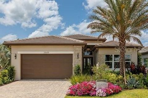 Photo of 32753 Neroli Street, Wesley Chapel, FL 33543 (MLS # J1000525)