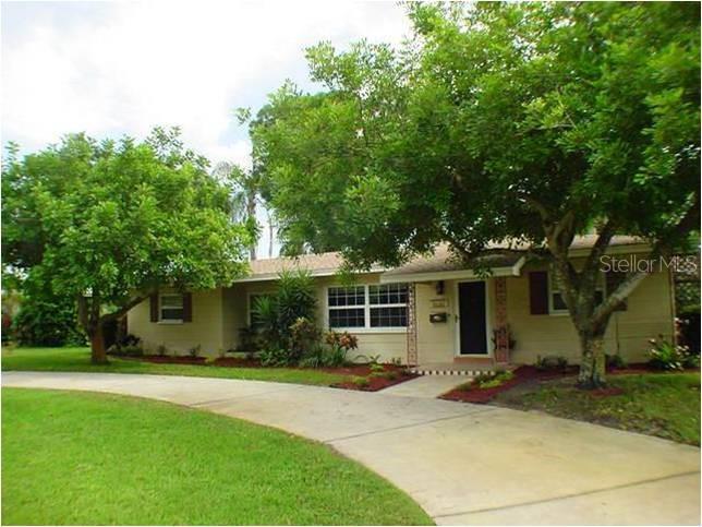 AWESOME LOCATION! This Spacious 3 Bedroom / 2 Bath home nestles between two lakes on a spacious lot (80 x 104) in beautiful, tree-lined Lake Pasadena. Quaint brick boulevards paint the perfect setting for leisurely walks. Enjoy the sweeping, sizzling vistas of pristine Lake Pasadena. Just a short drive to the best beaches, fine dining, schools, nature parks, entertainment, arts, downtown St. Petersburg, Tyrone Mall & Stetson Law School. This home features a brand new roof with newer appliances, great room floor plan and a bonus room wood burning fireplace. The backyard has been beautifully landscaped, in a park-like setting. create an entertainment paradise. This is a MUST SEE!