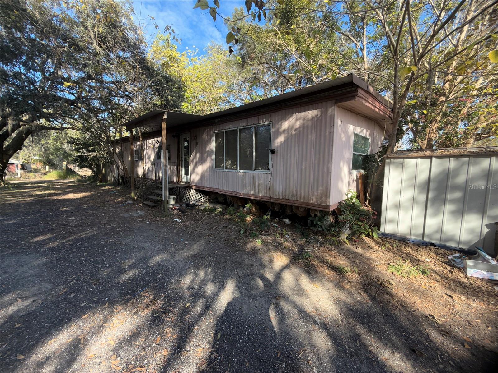 Attention investors, don’t miss this hidden gem in the heart of Davenport, Florida. This double wide mobile home with 1,242 ft.² of living space
has a 0.23 acre lot, with three bedrooms one bathroom and $65,000 renovation estimate ,this property holds incredible potential. The numbers speak for themselves a price of $99,000 and a potential ARV of $200,000 plus, the strategic location puts you near comercial facilities, major highways in the heart of Davenport. Similar properties nearby have sold for as much as $285,000 act now and secure this investment opportunity, for more details contact us! Hurry this property won't last long!