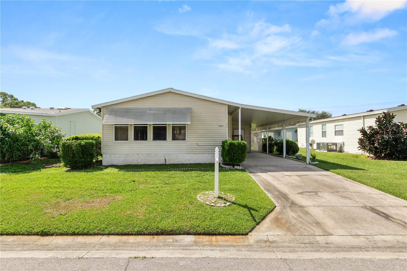 Take a look at this 2 bedroom 2 bathroom home located in the guard gated 55+ community of Cypress Lakes. This home features indoor laundry, and a utility room with washer dryer hooks up if you prefer. There is a 1 car carport and outdoor storage room. The home has a front all seasons room to add additional living space. There is a living room and a dinette located off the kitchen. The primary suite is extra spacious with extra sitting room, multiple closets and the bathroom has a stand up shower. The 2nd bathroom is also extra large with a sitting room, double closets and the washer/dryer. The 2nd bathroom features a tub/shower combo. Enjoy this very active community with amenities including a community pool, pickle ball, tennis and shuffleboard courts as well as a clubhouse and restaurant. Schedule your private showing today!