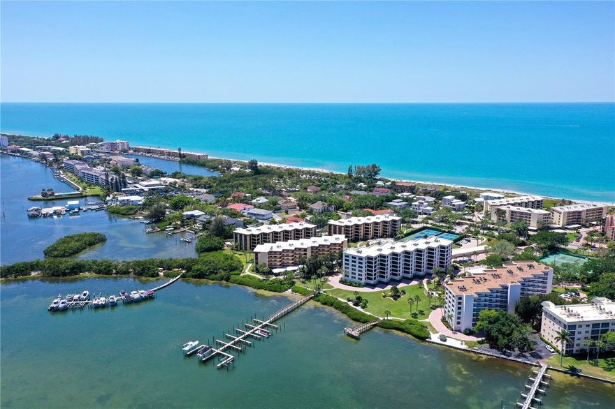 NEW PRICE DROP!!  MOTIVATED SELLER!!  PRIVATE GARAGE!!
Welcome to Turtle Bay! Amazing bayfront living on Siesta Key with boat slips and deeded beach access.  This beautifully furnished 2 bedroom and 2 bathroom condo offers buyers an active beach lifestyle or a coastal retreat. The condo boasts water views from the screened in lanai where you can enjoy a morning sunrise.  Freshly painted with a brand new refrigerator, garbage disposal and kitchen faucet home chefs will enjoy cooking in this open kitchen.  If you do not want to cook it is quick trip to Siesta Village where you can enjoy great restaurants and fun shopping.  Turtle Bay has an array of amenities from tennis courts, heated pool and spa as well as boat slips available on a first come first served basis for an annual fee. Not only does this unit offer a private laundry room with a new washer it also has a one car garage with a new opener.  The garage has ample room for a vehicle and storage adding value to this home.  The location of Turtle Bay is a quick 20 minute ride to experience the arts and culture of downtown Sarasota.  This condo offers the best of Siesta Key living.  Enjoy the sunsets on the beach with the deeded beach access across Midnight pass Road. If you are looking for an updated furnished condo with newer furnishing this is the place for you.